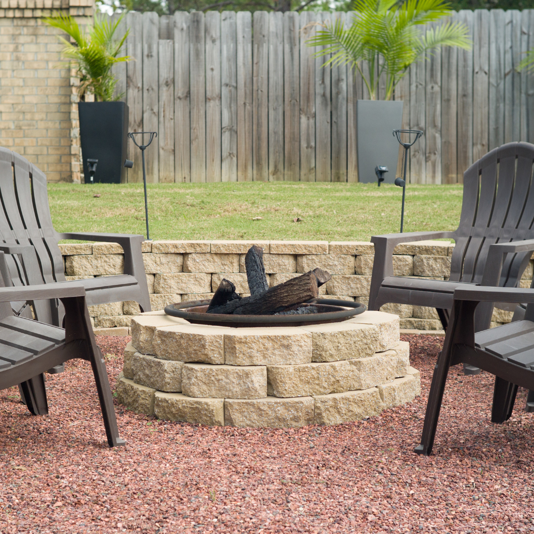 Basic stone fire pit with chairs around it