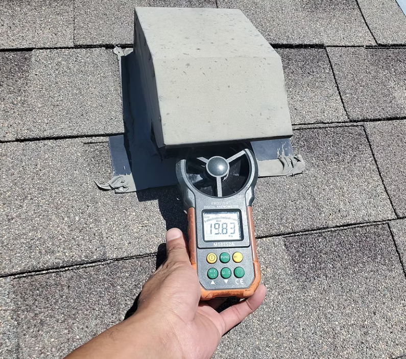 Hand vacuuming a white vent in a room with wood and white surfaces. Hand vacuuming a white vent in a room with wood and white surfaces.