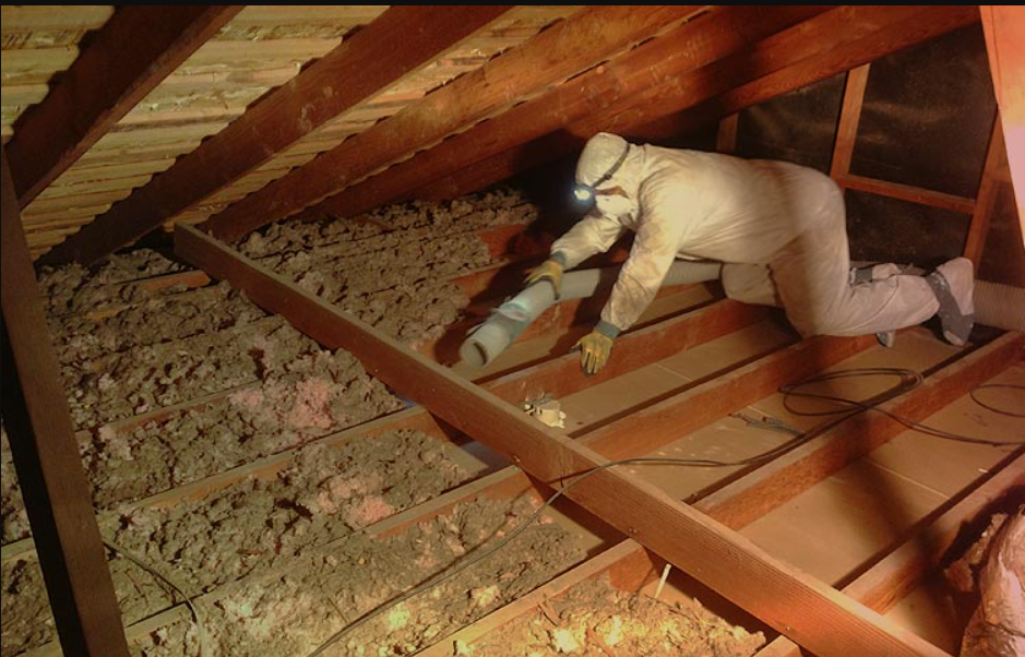 Attic interior with spray foam insulation on walls and rafters, unfinished floor and a window. Attic interior with spray foam insulation on walls and rafters, unfinished floor and a window.