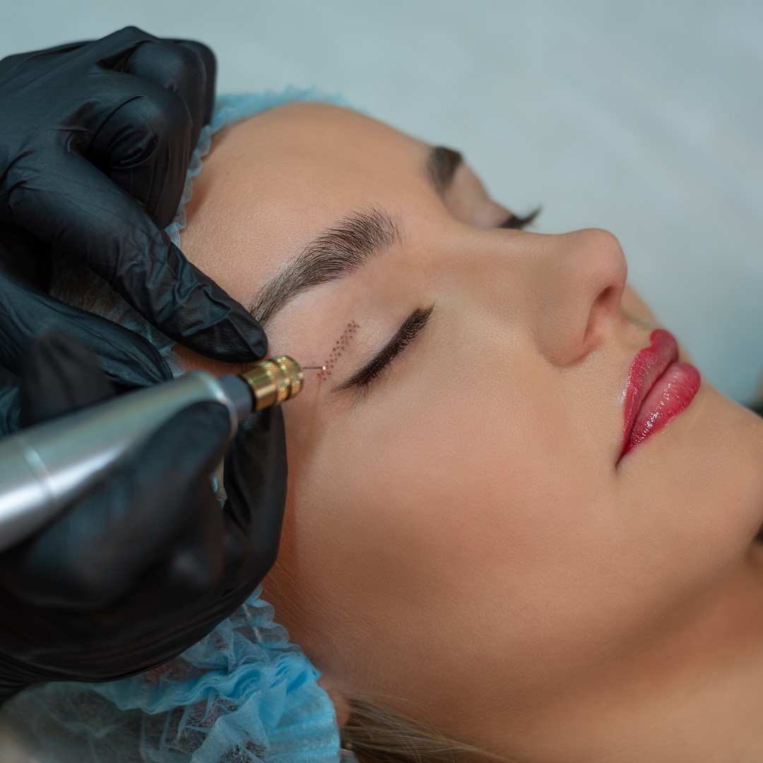 Woman getting eyeliner tattoo with a gloved hand holding a pen-like tool to her closed eye.