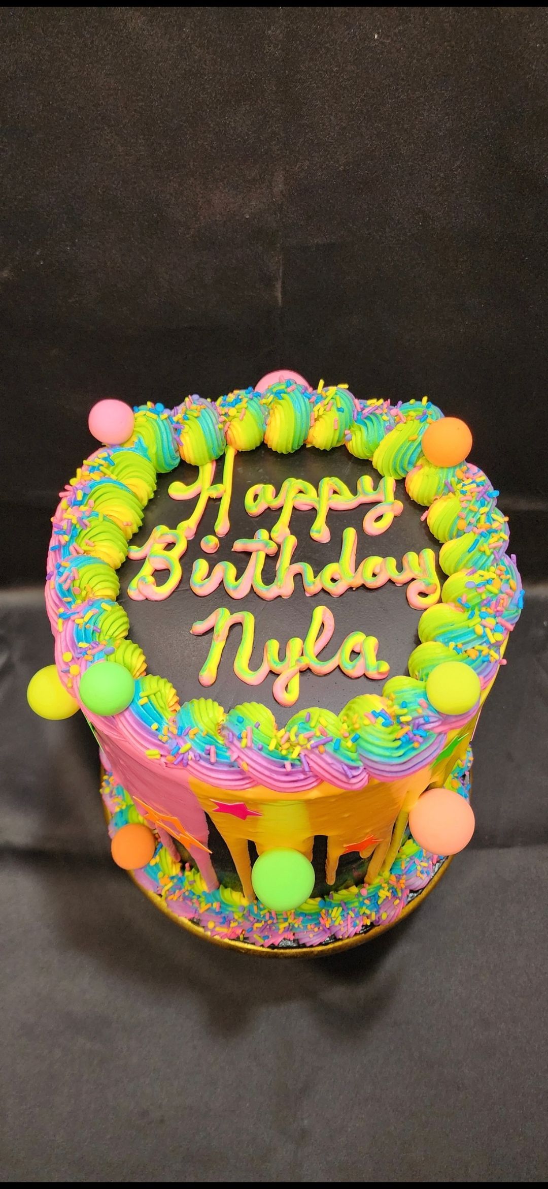 A birthday cake that says happy birthday nyla on it