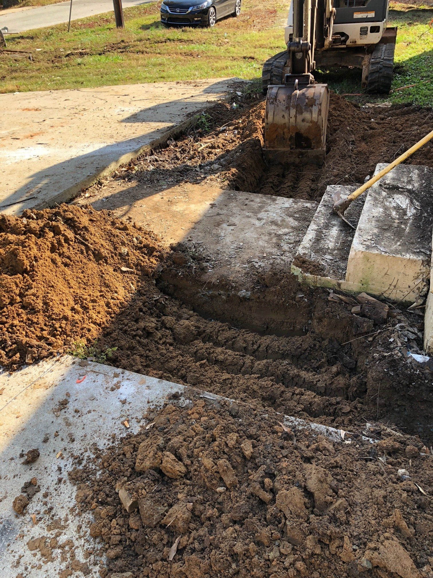 a bulldozer is digging a hole in the ground .