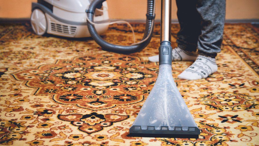 Vacuuming The Rug — Valley, NY — Classic Carpet and Upholstery Cleaning