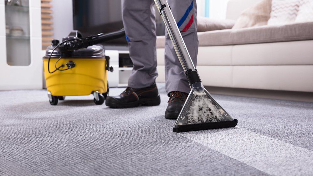 Vacuuming The Carpet — Valley, NY — Classic Carpet and Upholstery Cleaning