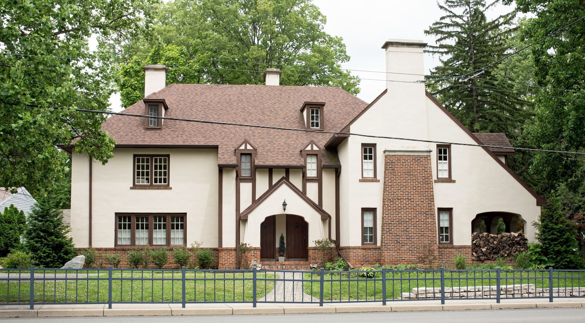 A large white house with a brown roof