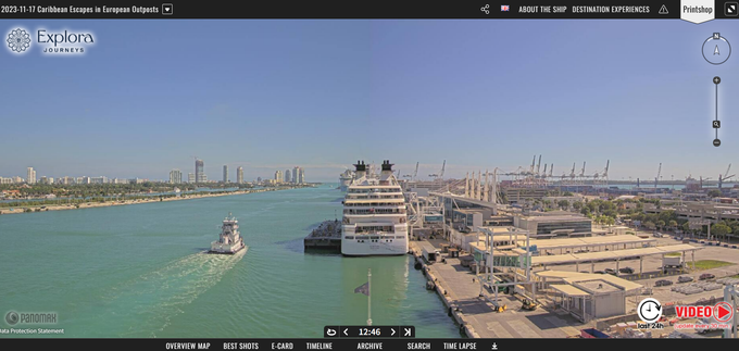 An aerial view of a cruise ship docked in a harbor