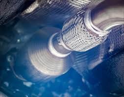 A Person Is Holding A Black And Yellow Object In Their Hand — Ballina Rego & Mechanical Centre In Ballina, NSW