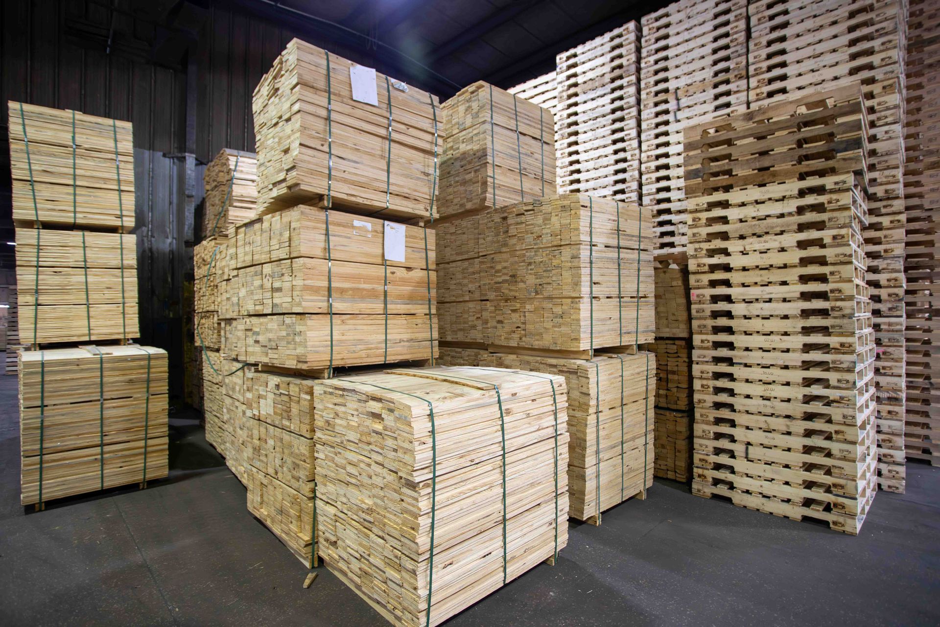 A warehouse filled with lots of wooden boxes and pallets