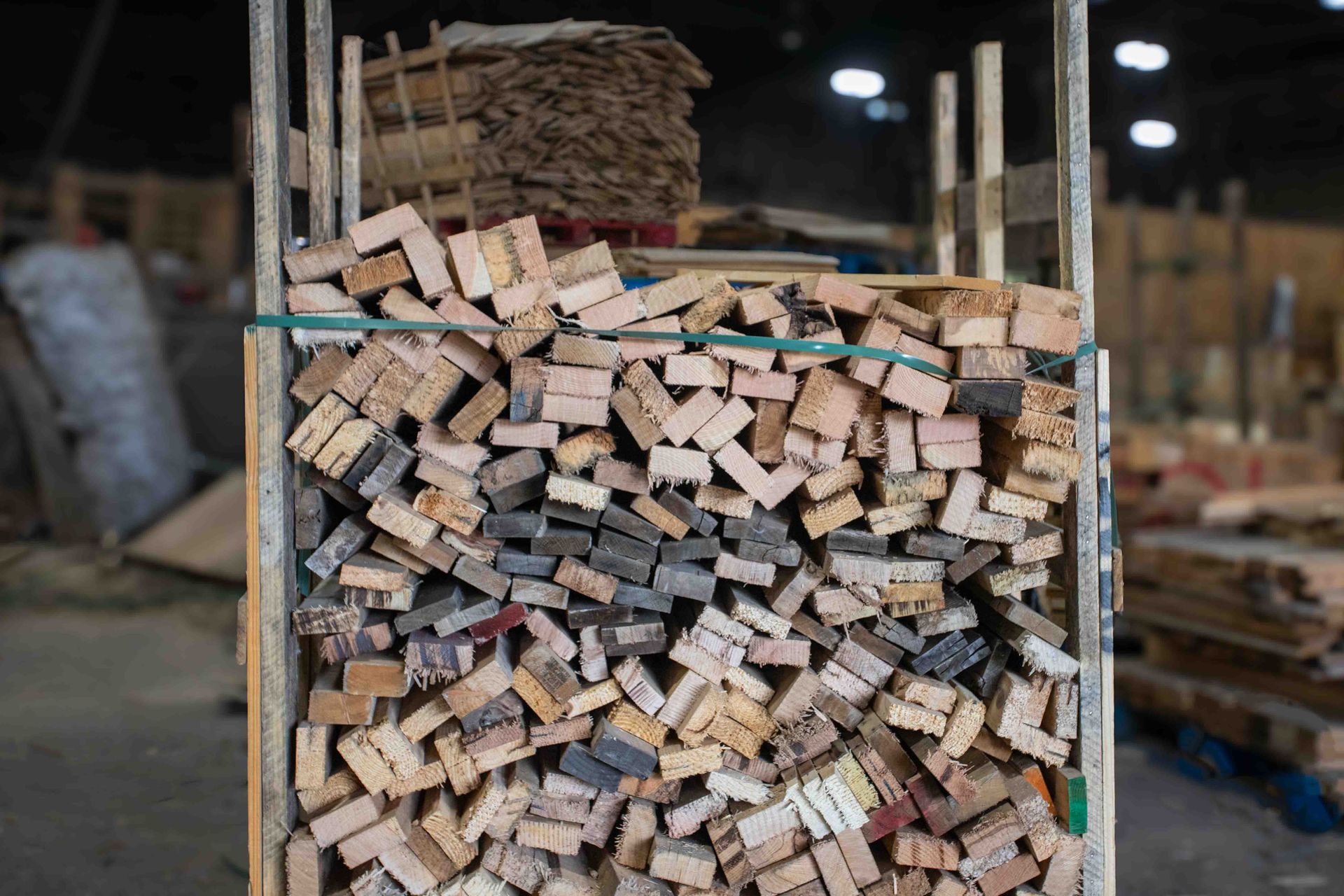 A pile of wood is stacked on top of each other in a warehouse.