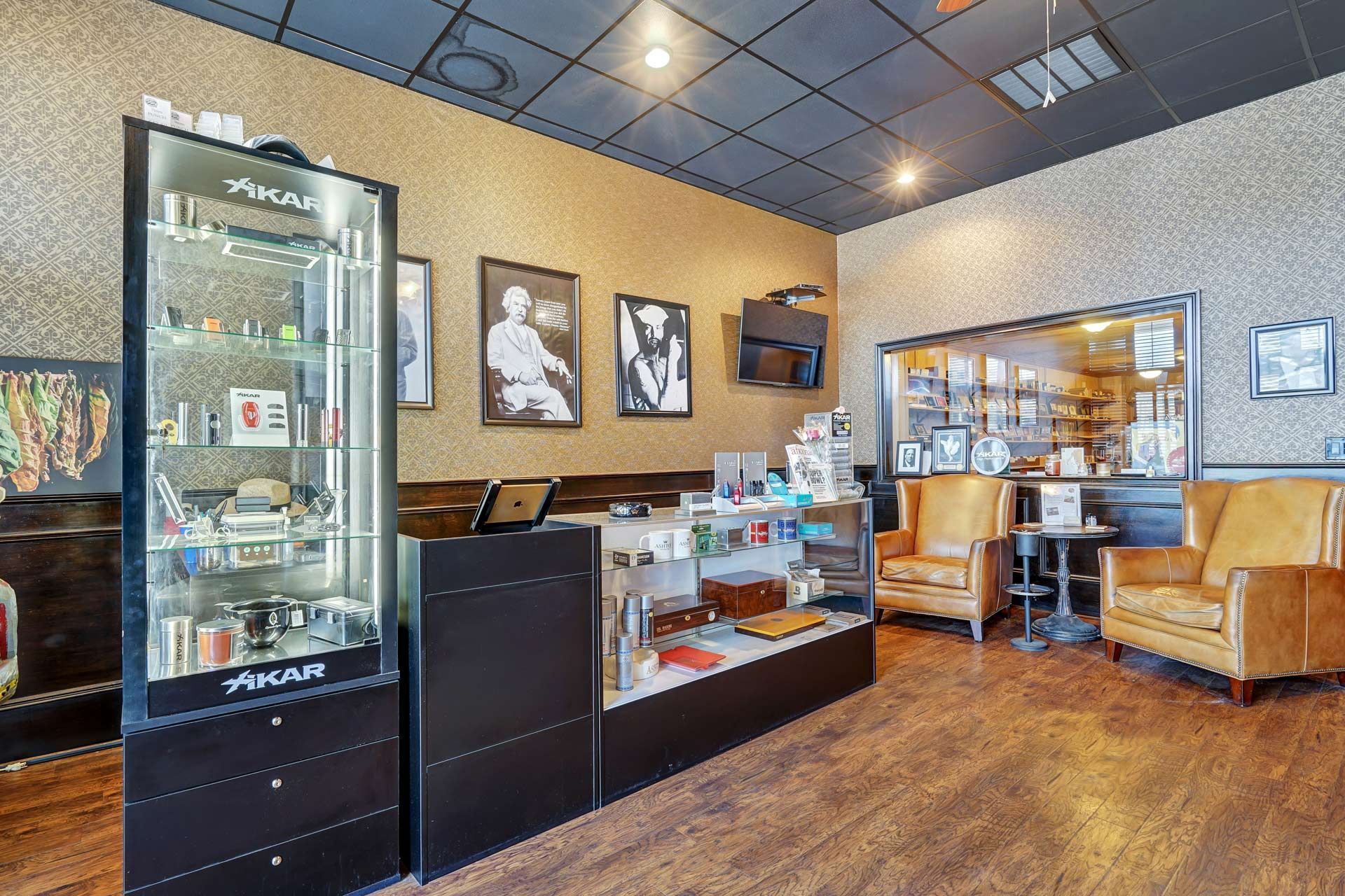 A room with a lot of furniture and a display case