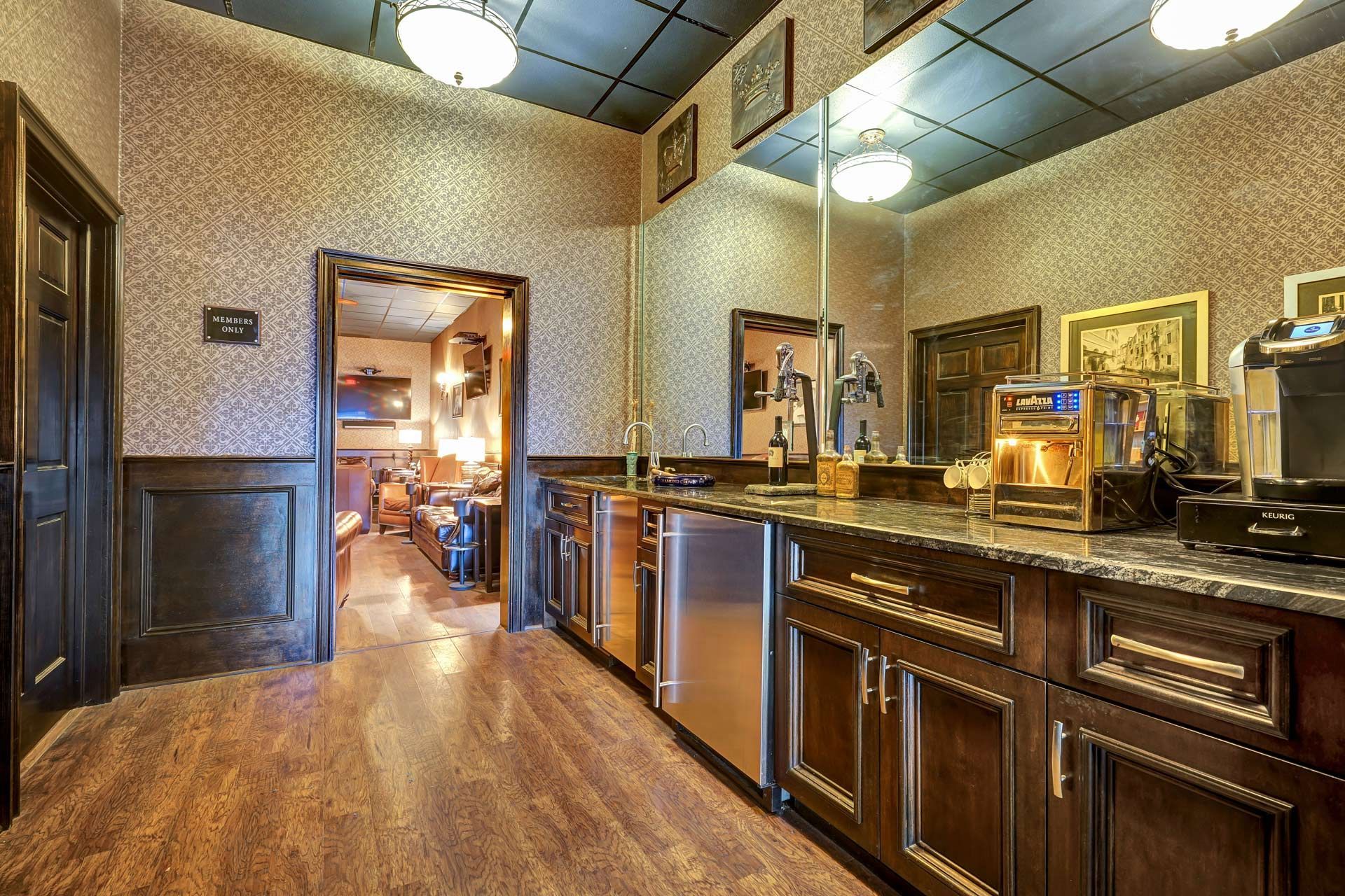 A kitchen with stainless steel appliances and wooden cabinets.
