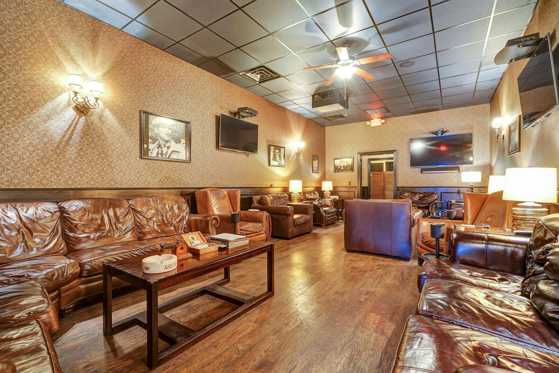 A living room filled with furniture and a ceiling fan