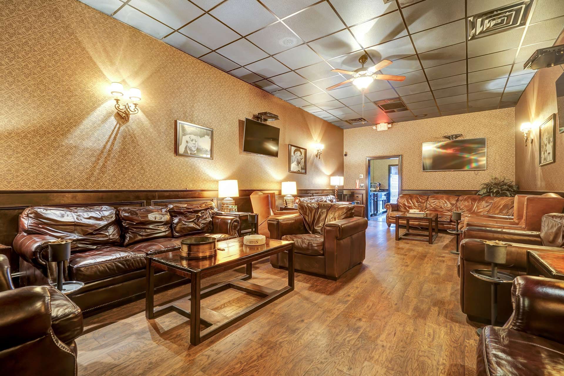 A large room filled with furniture and a ceiling fan