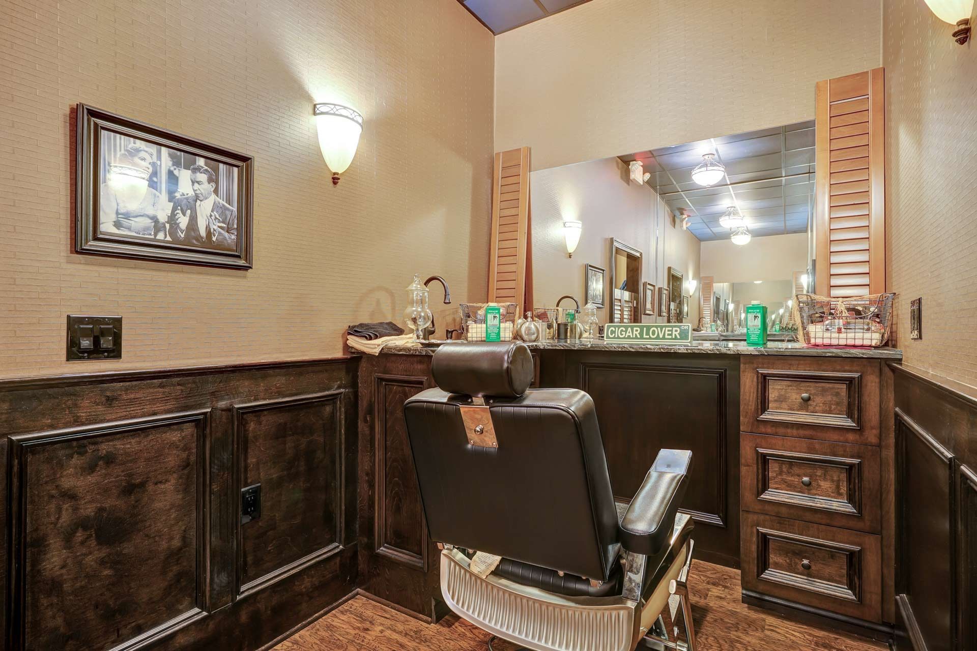 A barber shop with a barber chair and a mirror