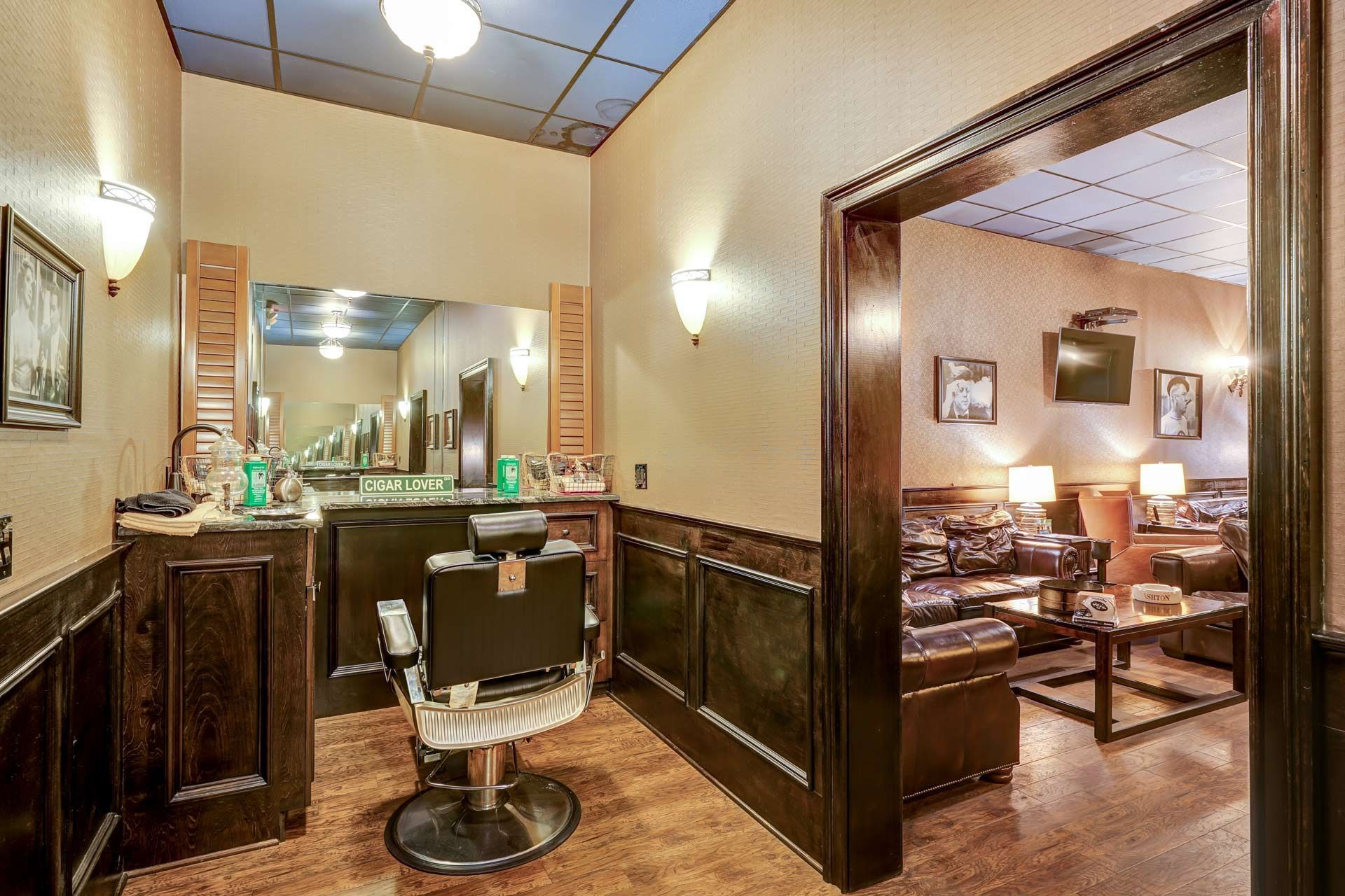 There is a barber chair in the middle of the room