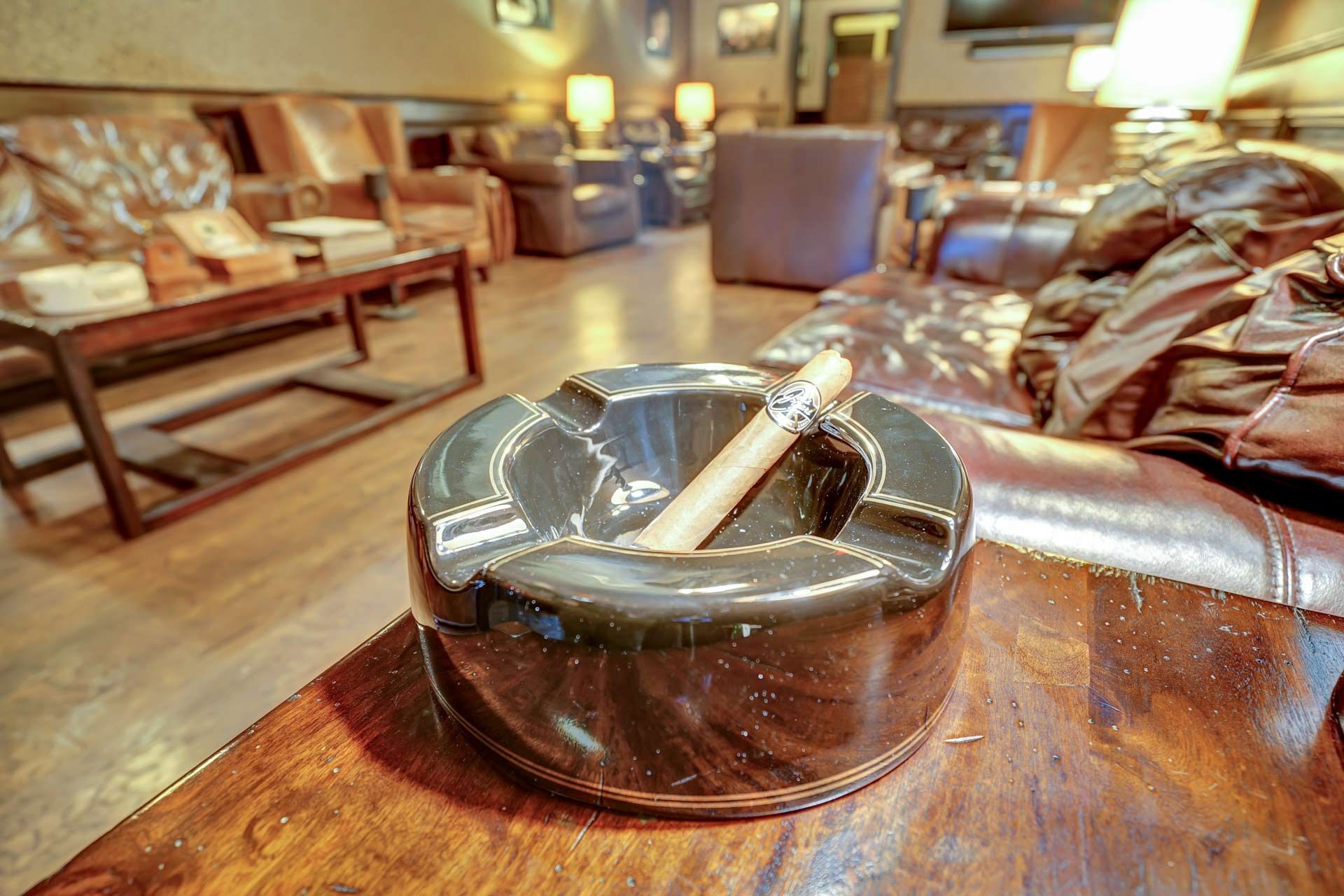  Classic ashtray holding a cigar