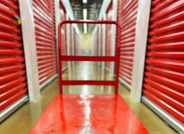 red moving dolly in storage facility