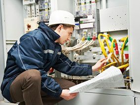Commercial electrician working on wires