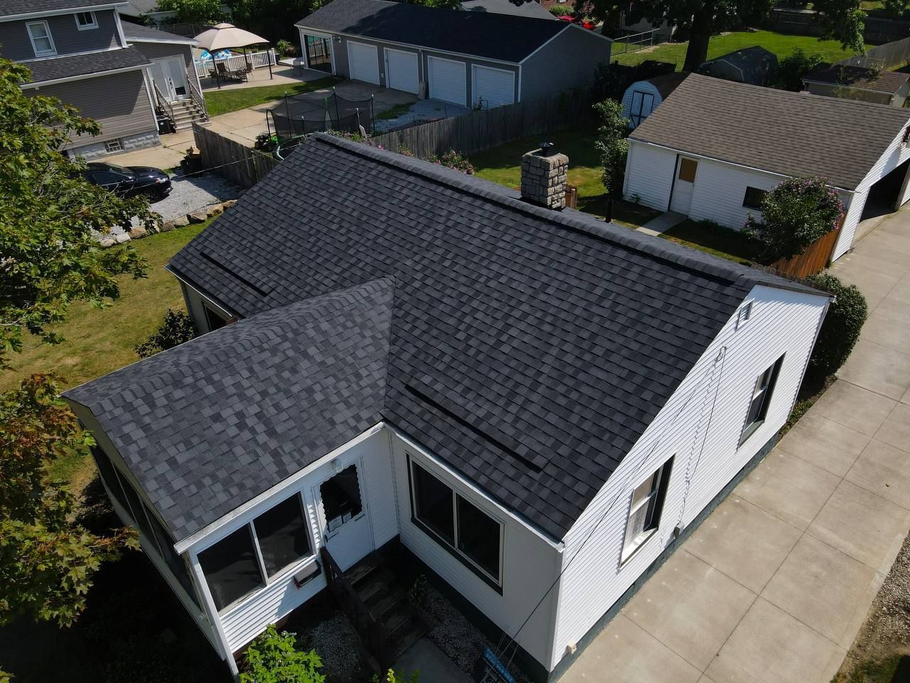An aerial view of a house with a new roof