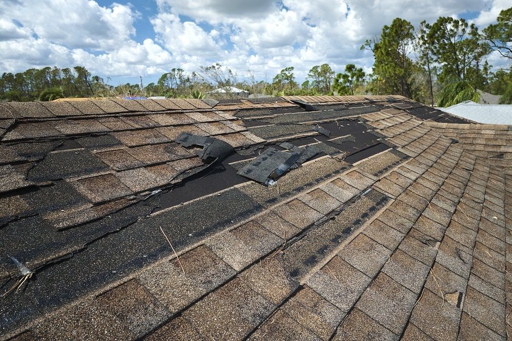 A roof that has been damaged by a storm