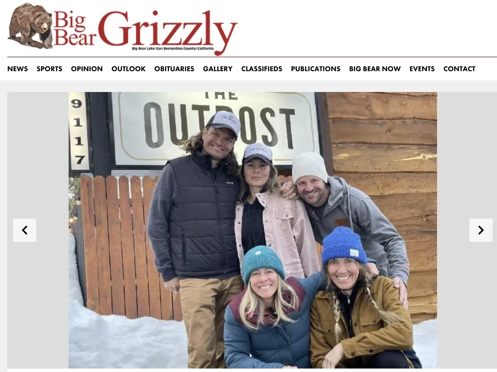 People posing in front of 