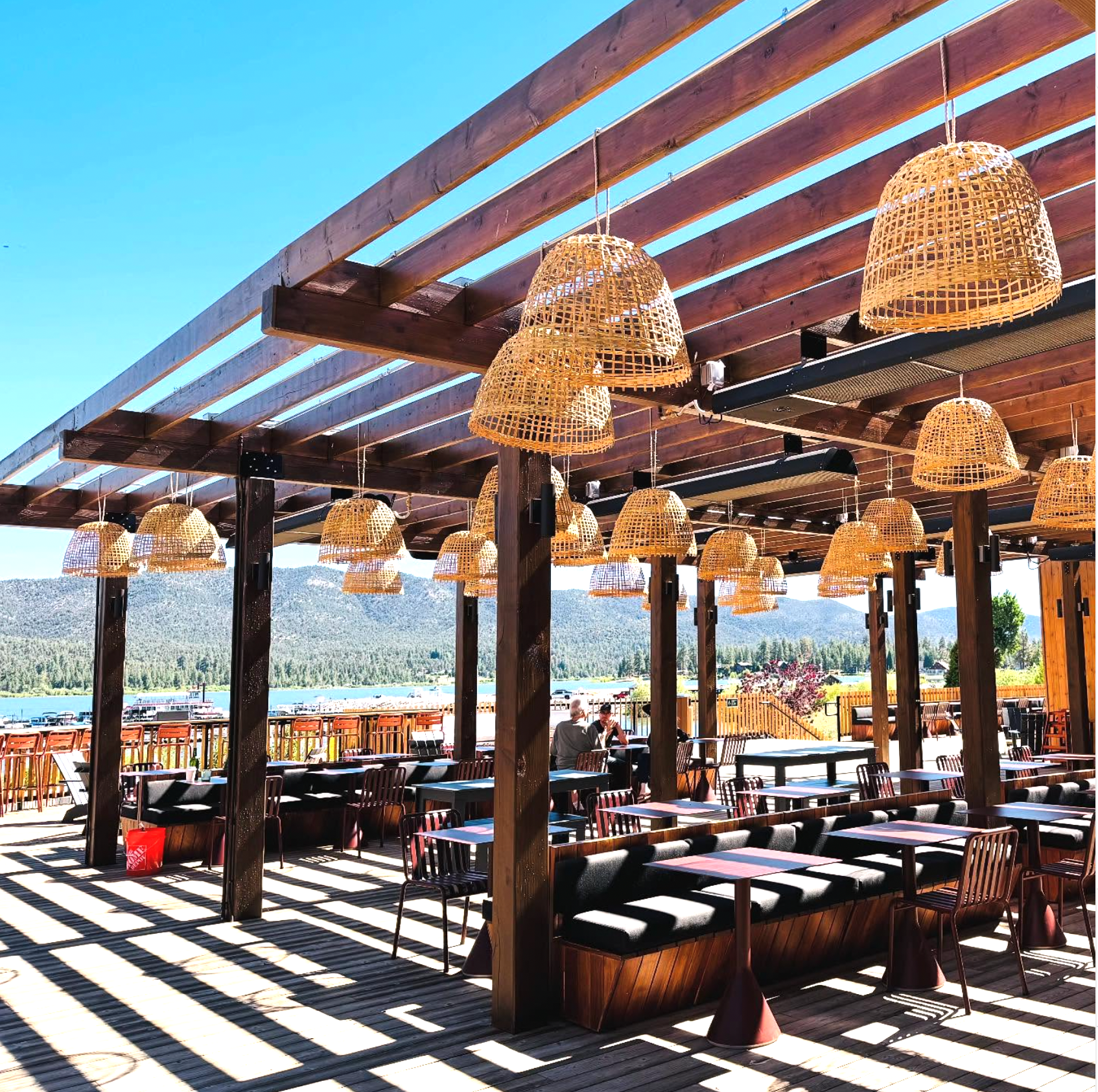 Stella Luna restaurant exterior with outdoor seating and a striped umbrella.