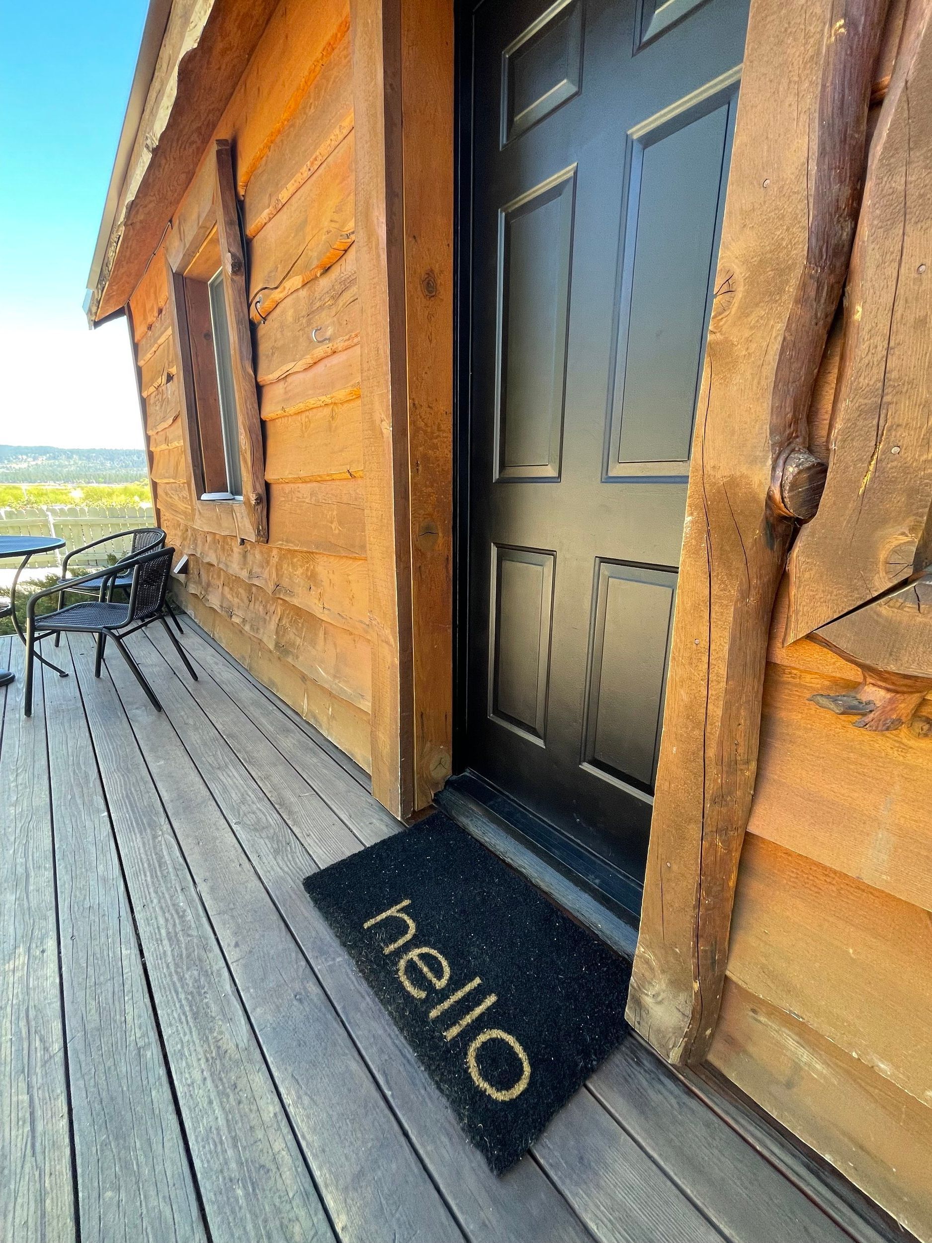 Wooden cabin with black door, 