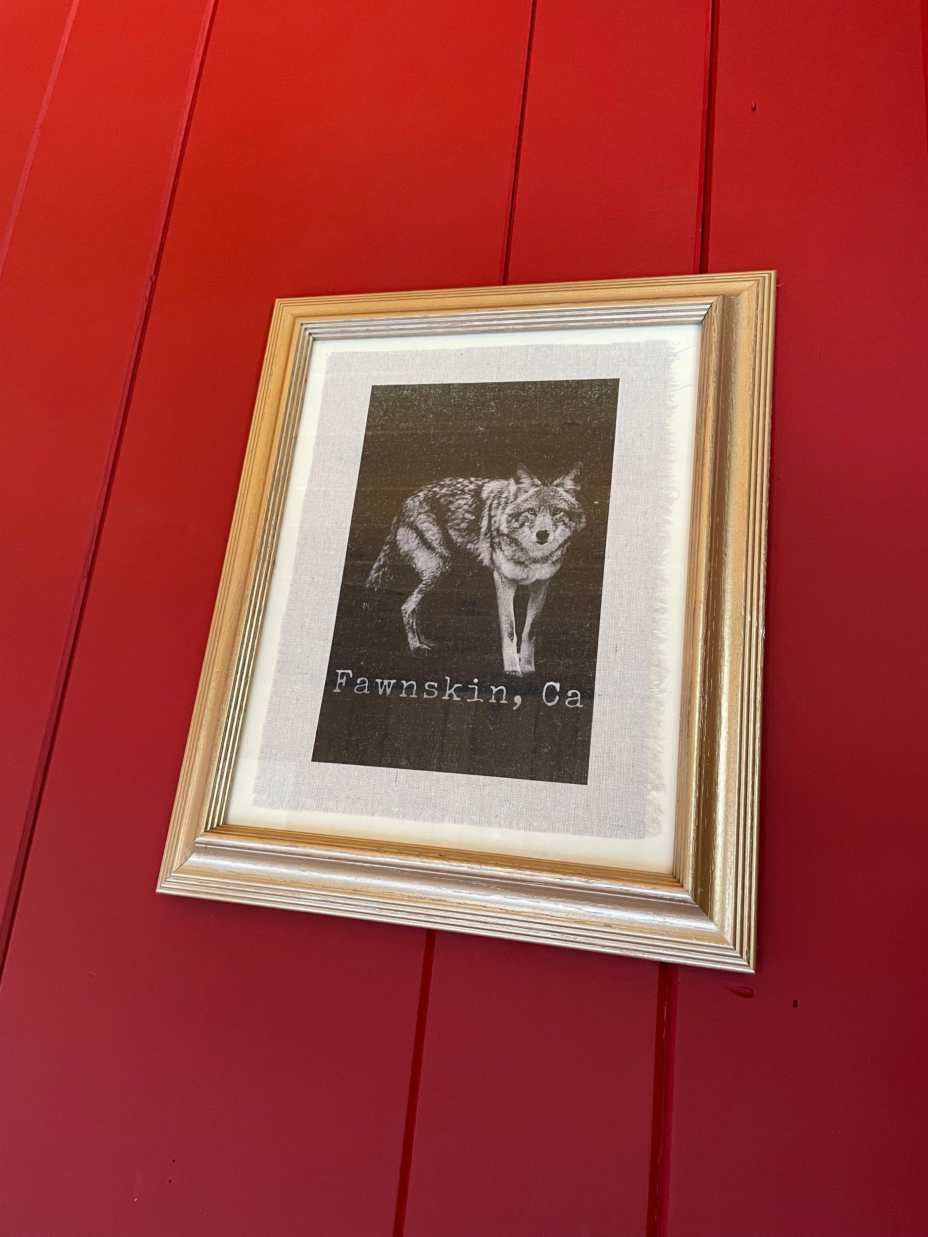 Framed artwork of a wolf with text 