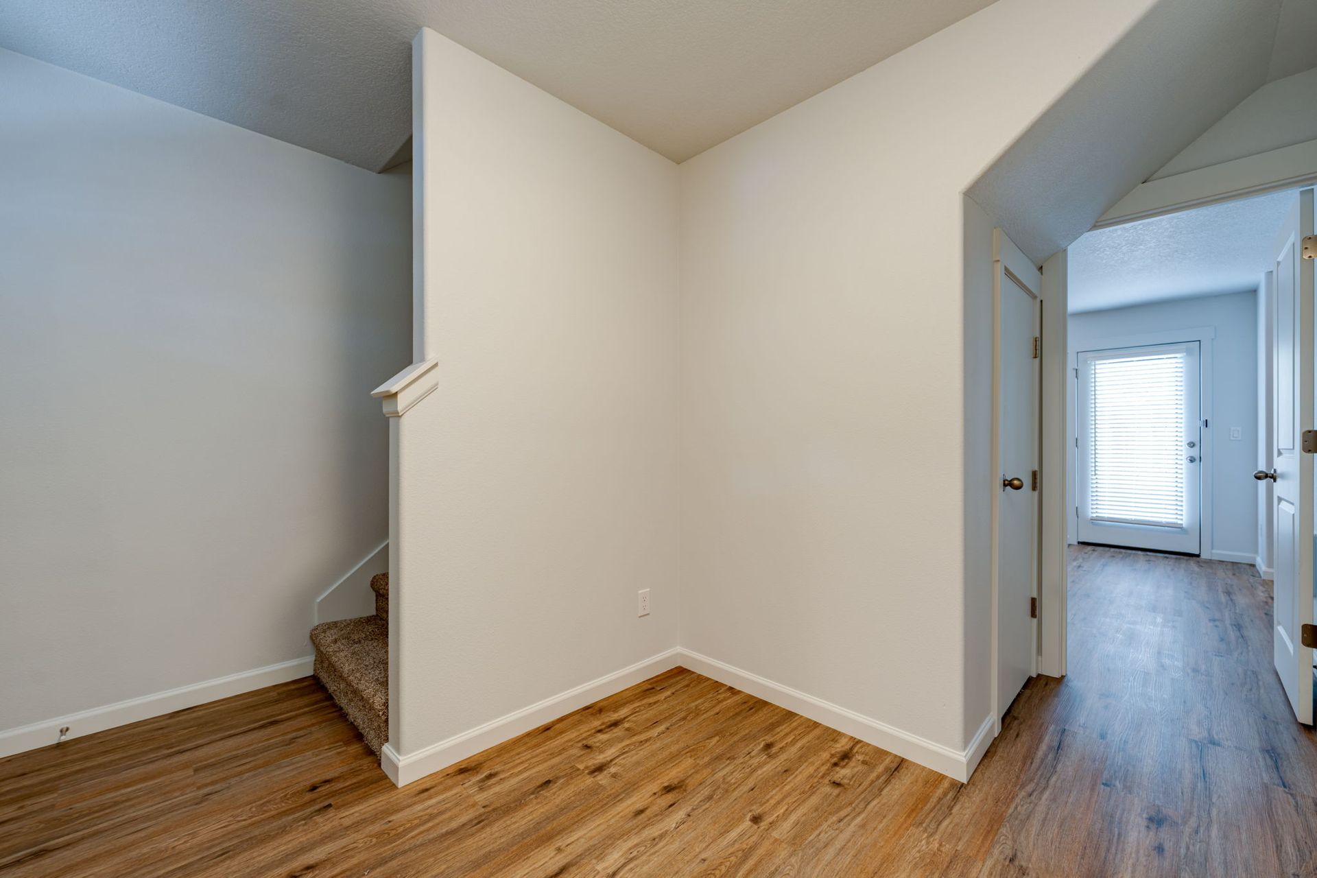 Entryway with view into ground floor bedroom