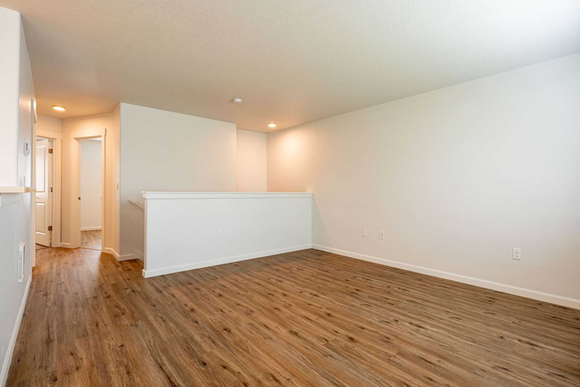 view of living room with enclosed stairway in the background