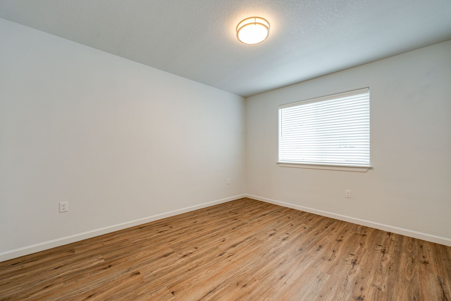 second second-floor bedroom unfurnished with window in the background