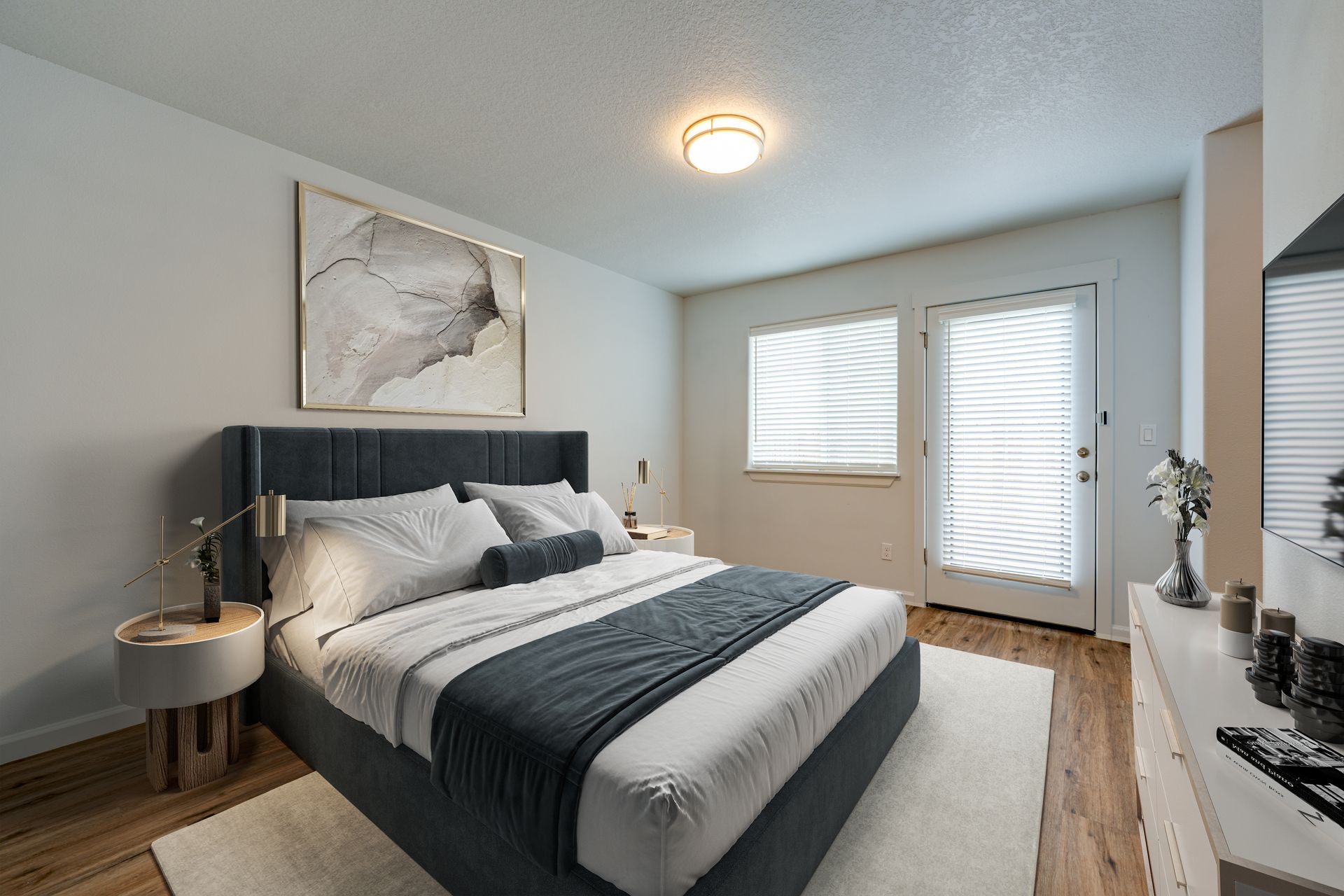 ground floor bedroom furnished with window and pation door in the background