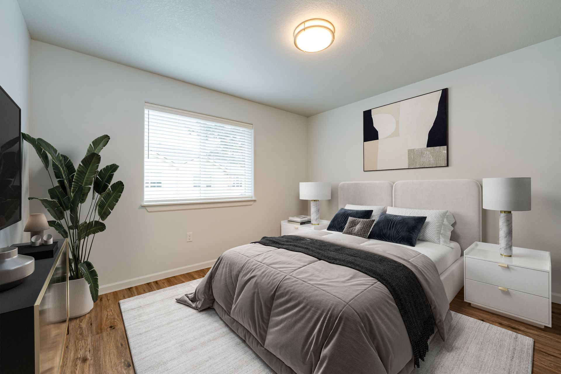 first second-floor bedroom furnished with window in the background