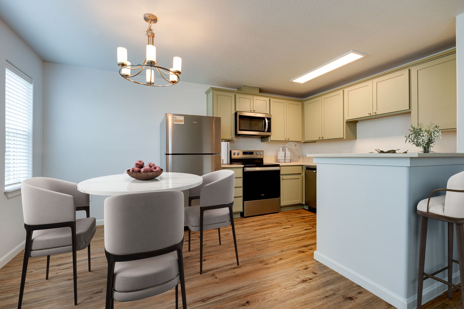 view of furnished dining room looking into the kitchen