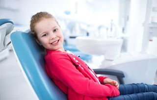 Tooth Filling — Beautiful Smiling Little Girl in Dental Office in Lafayette, IN