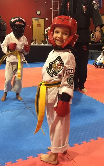 An aerial view of a city skyline at sunset.