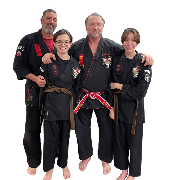 a group of children are practicing martial arts together .