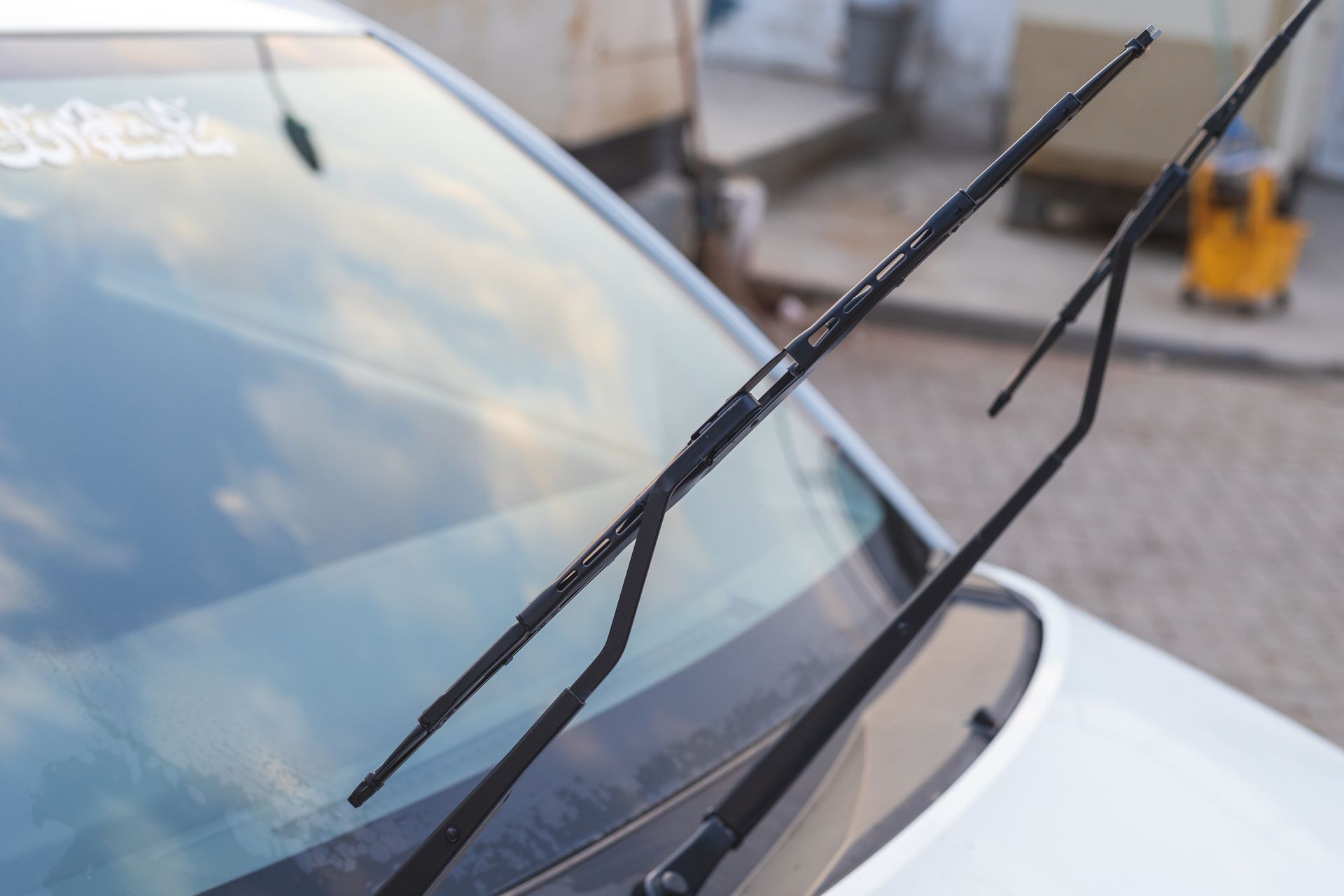 A close up of a windshield wiper on a car