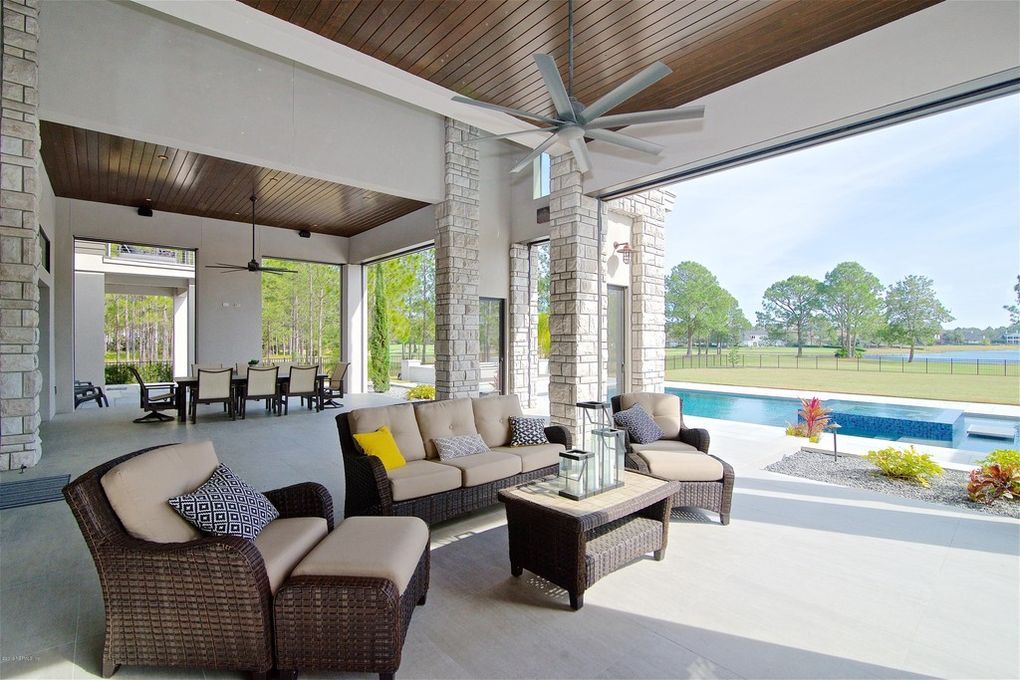 A patio with a couch and chairs — Jacksonville, FL — Stonecore