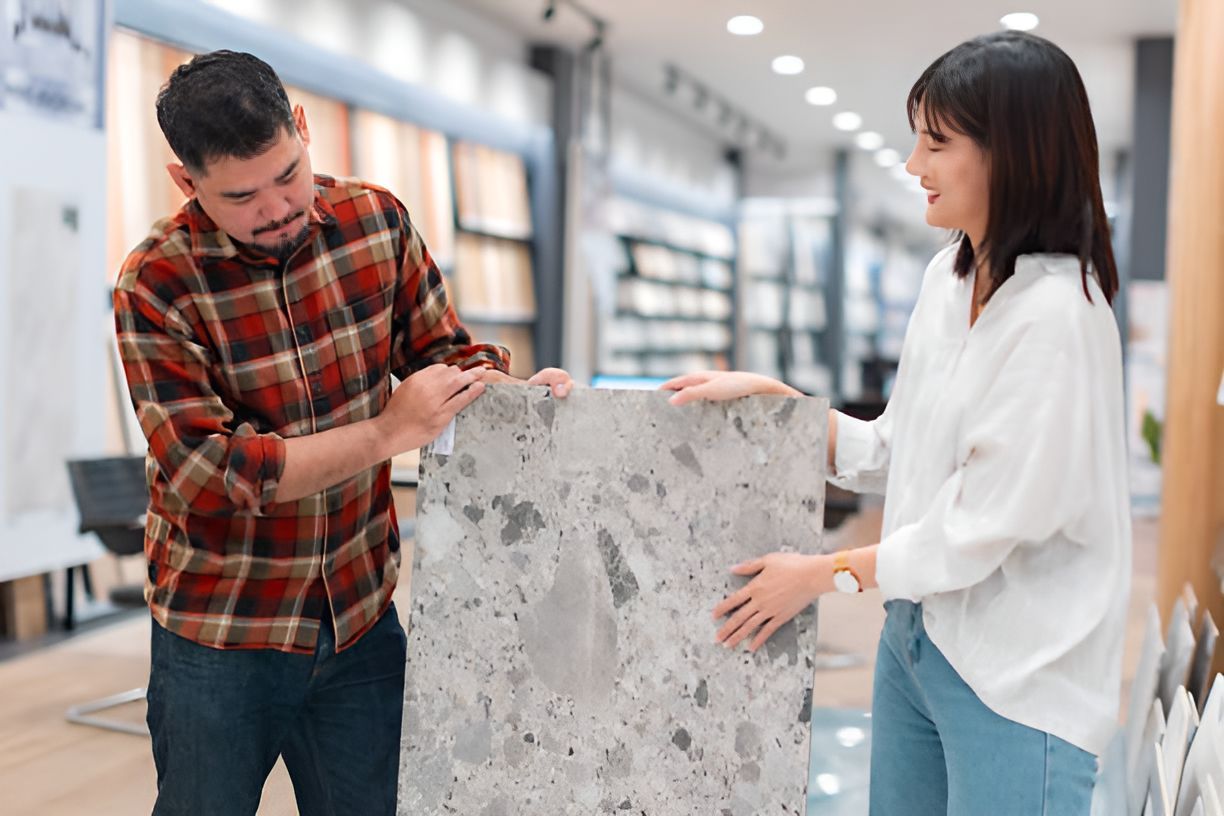 New Home Choices. Couple at A Material Store Choosing Quartz Countertop 