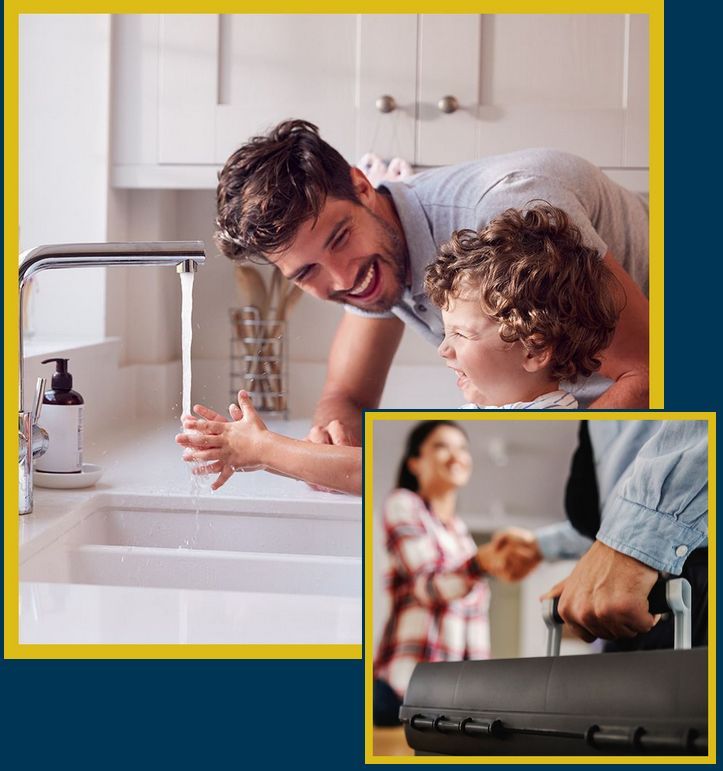 man and a child are washing their hands