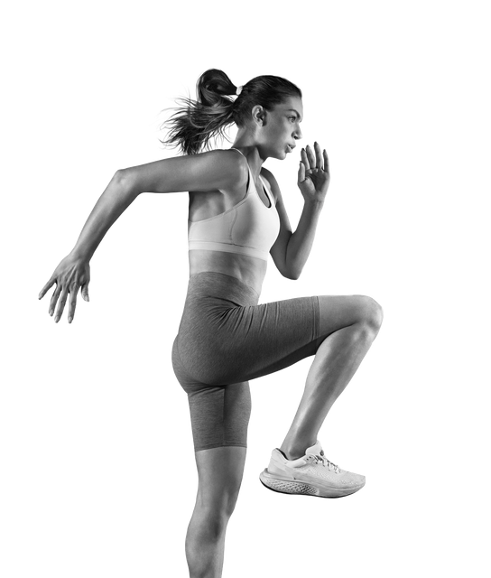 A woman is running in a black and white photo.