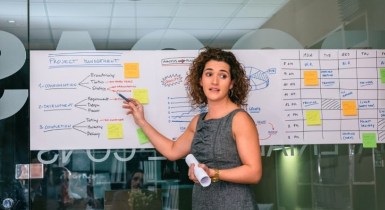 Picture of a Business  Coach in discussion with a business owner