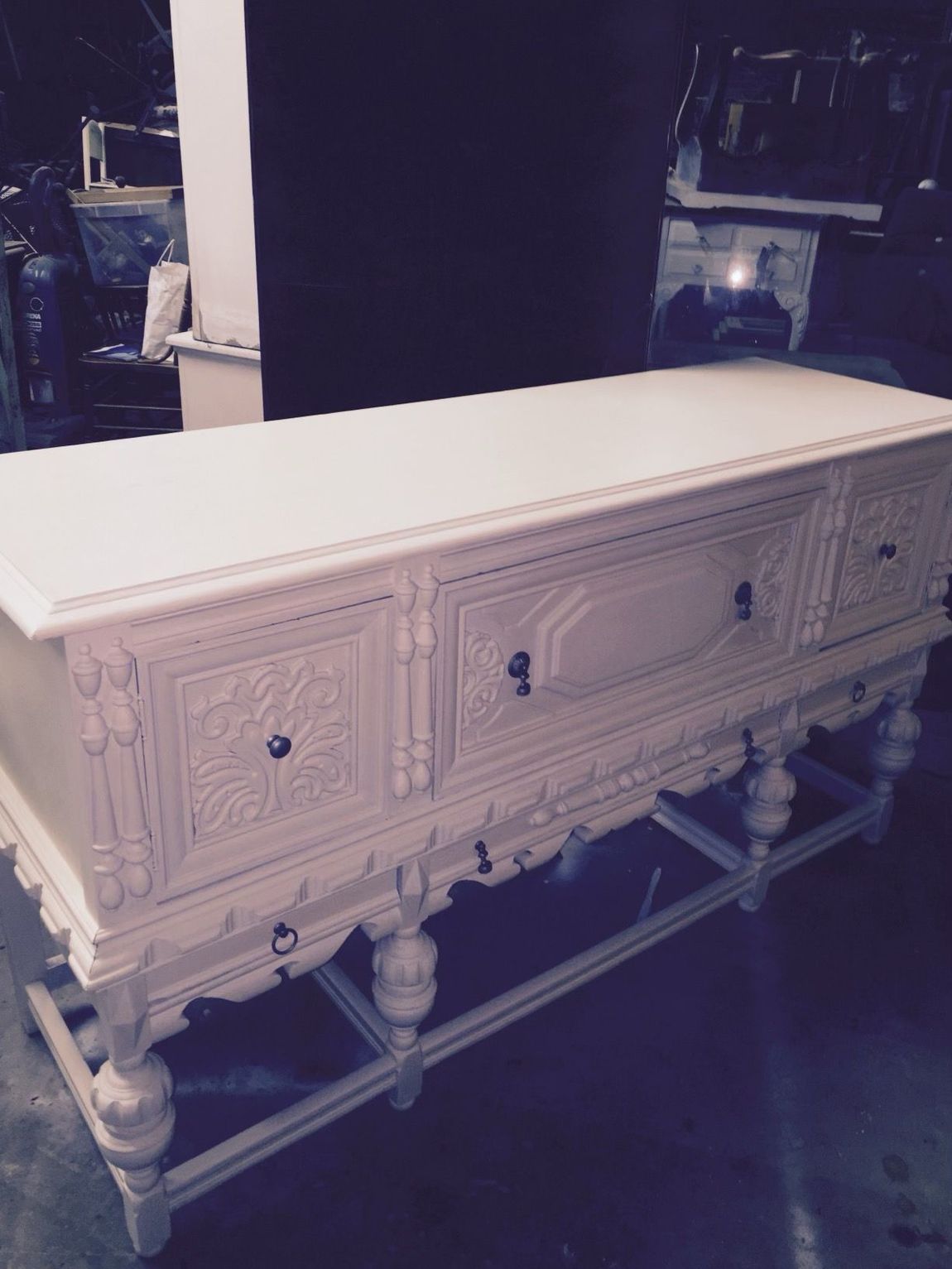 A white dresser with drawers and a white top