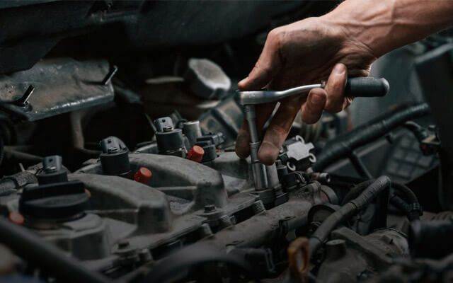 Men Repairing the car | Strickland Automotive Repair Inc.
