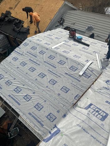 a group of people are working on a roof replacement The Amish Roofer (940) 278-8299
