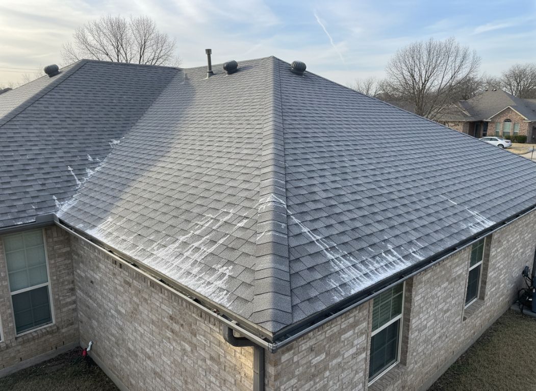 image of a Texas suburban home roof during late winter, with melting frost