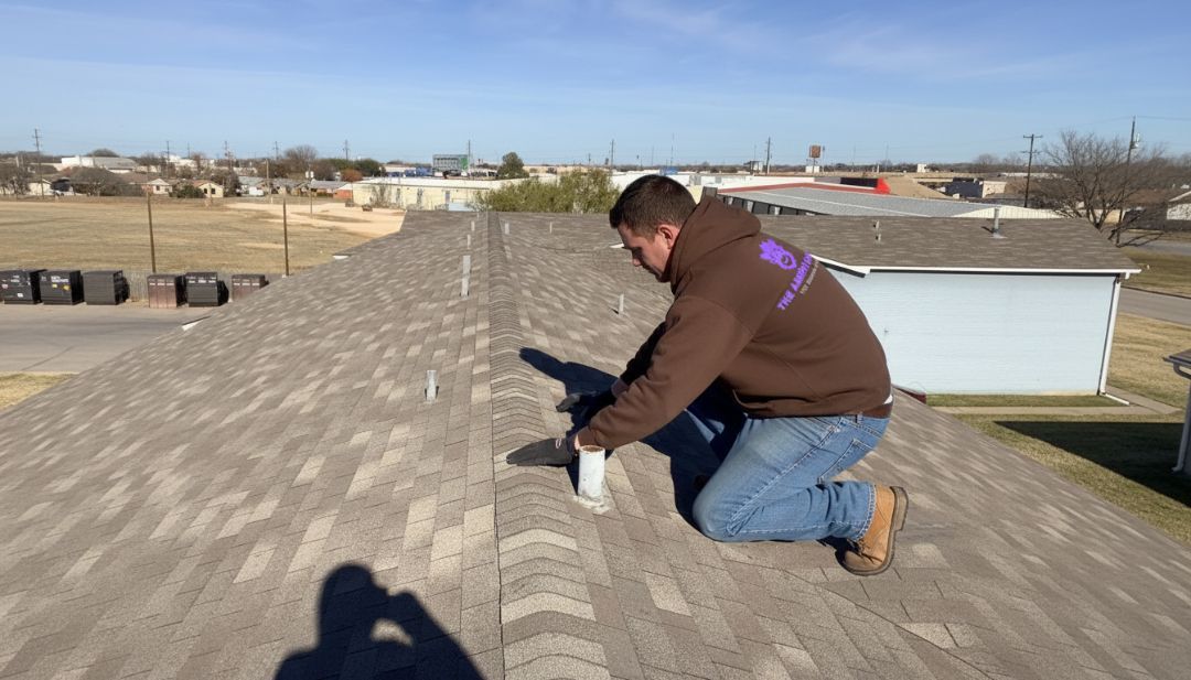 The Amish Roofer inspecting a North Texas roof during winter weather