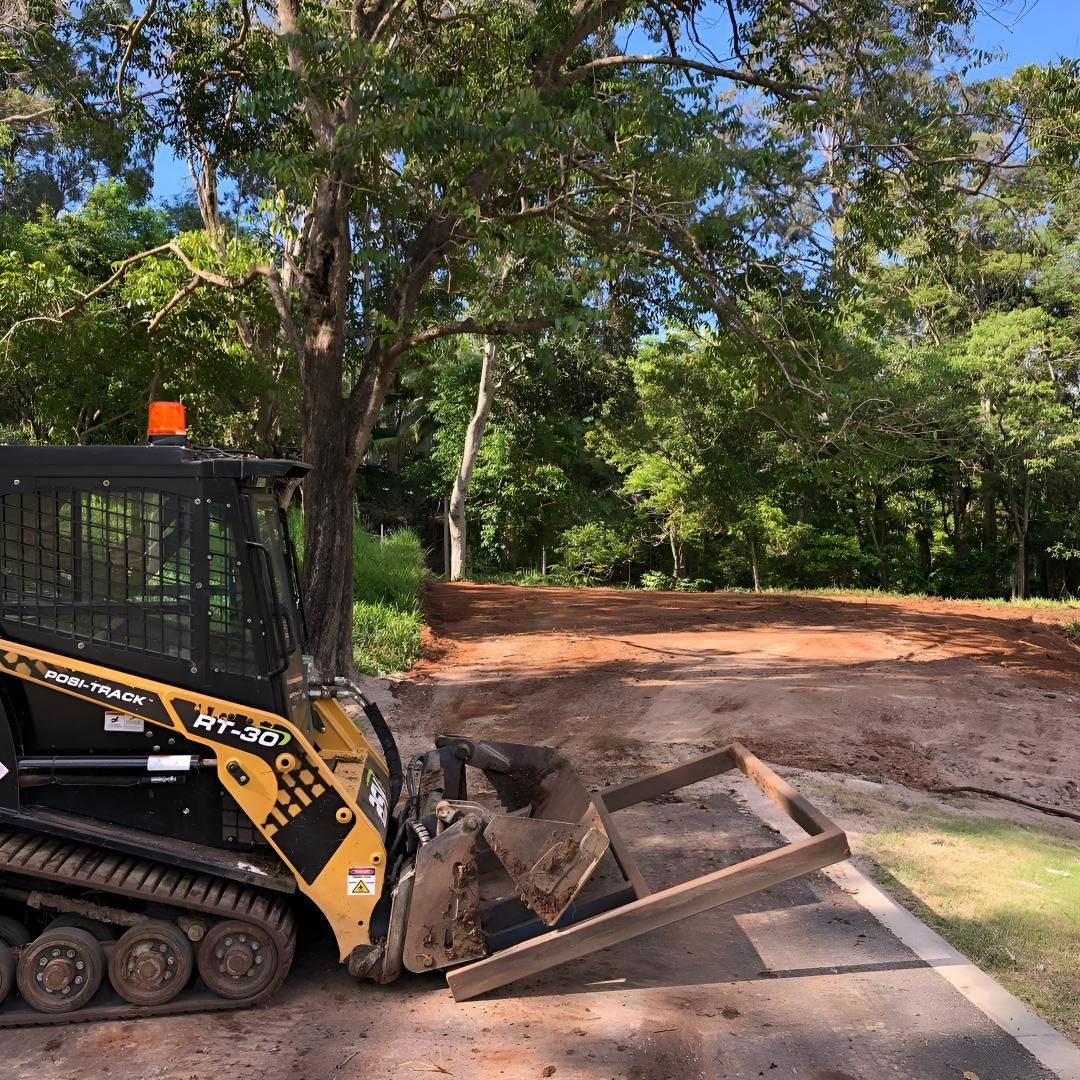 A Yellow and Black Bulldozer is Sitting on the Side of a Road — Limited Access Excavation In Casino, NSW