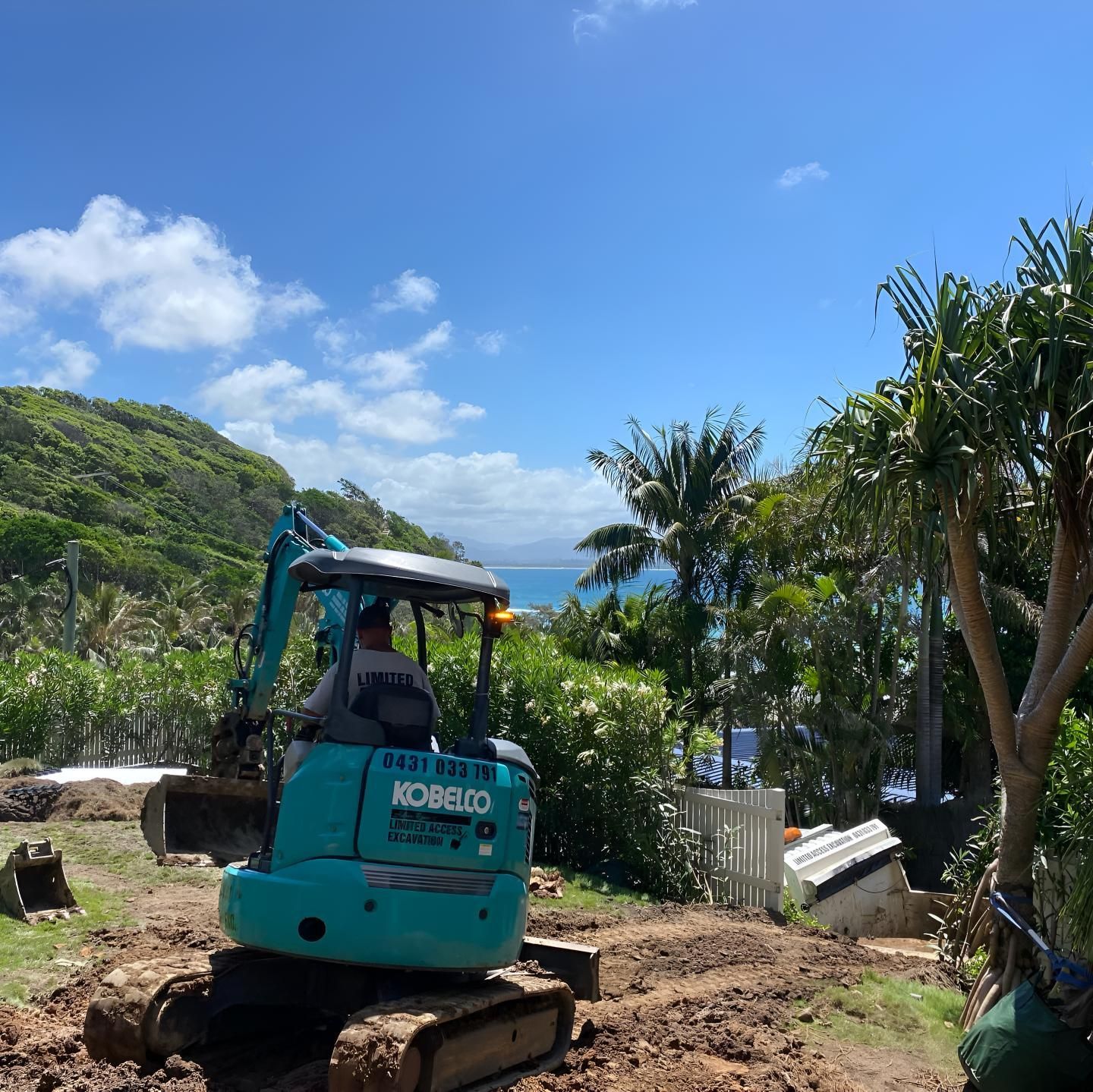 A Kobelco Excavator is Working on a Dirt Road — Limited Access Excavation In Evans Head, NSW